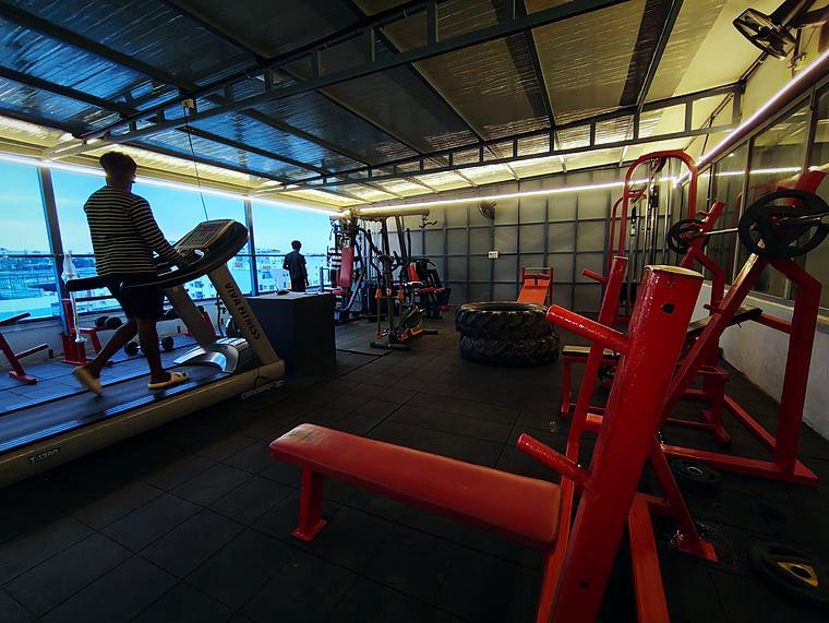 Rooftop gym with professional equipment at Vaikuntum Elite Co-Living, Bommanahalli
