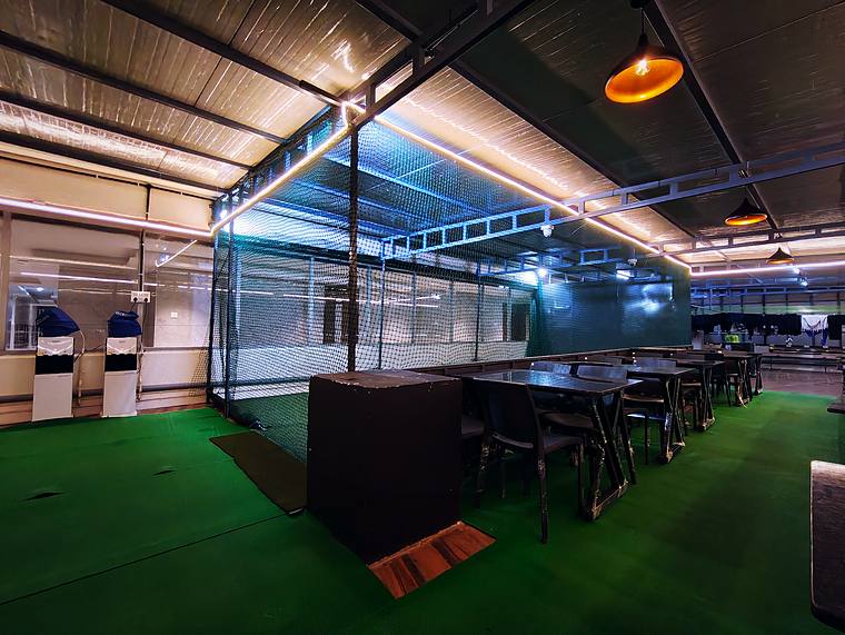 Rooftop box-cricket arena with nets at Vaikuntum Elite Co-Living, Bommanahalli